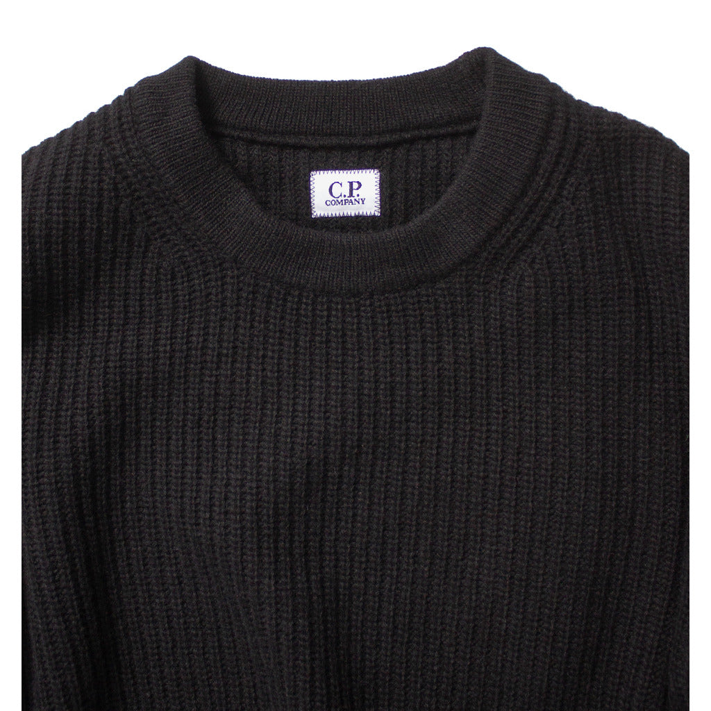 View of the classic crew neck on the CP Company black wool blend sweater.