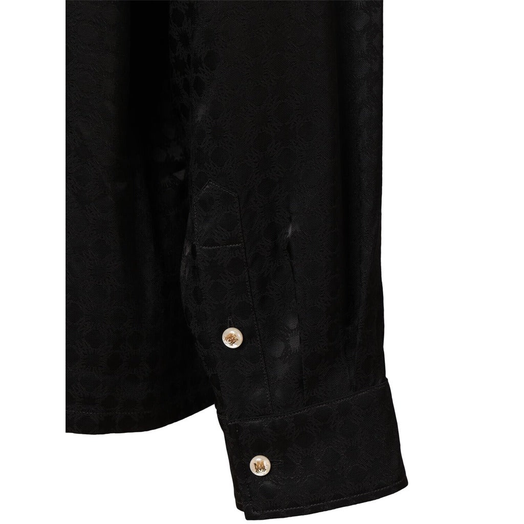 Close-up of the button cuff on the long sleeve of the Amiri MA Quad viscose notched collar shirt.
