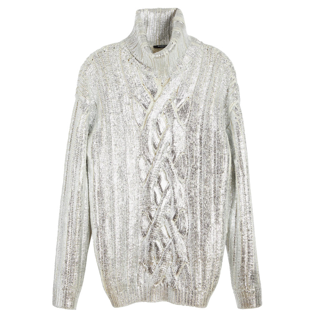Silver metallic cable knit texture on the Balmain turtleneck sweater.
