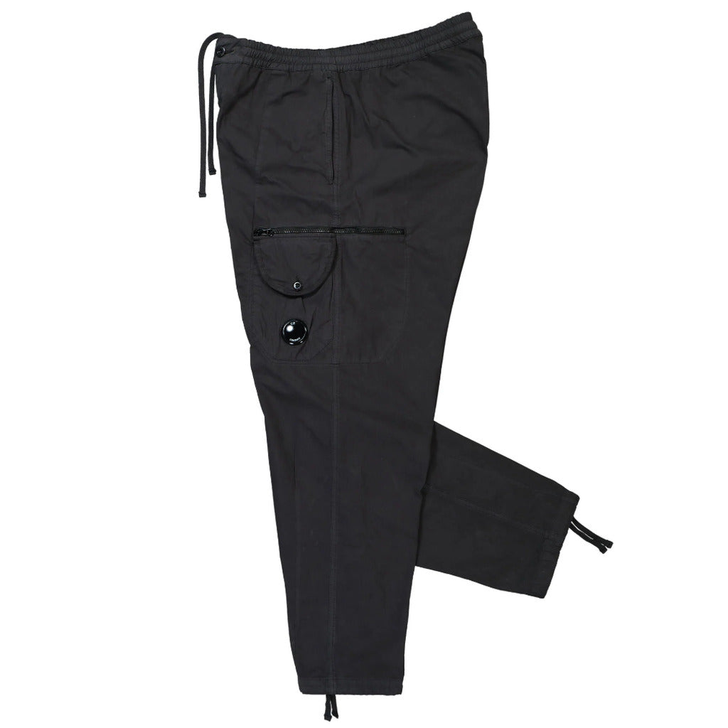 View of the elasticated waist and button fastening on the CP Company black Microreps cargo pants.
