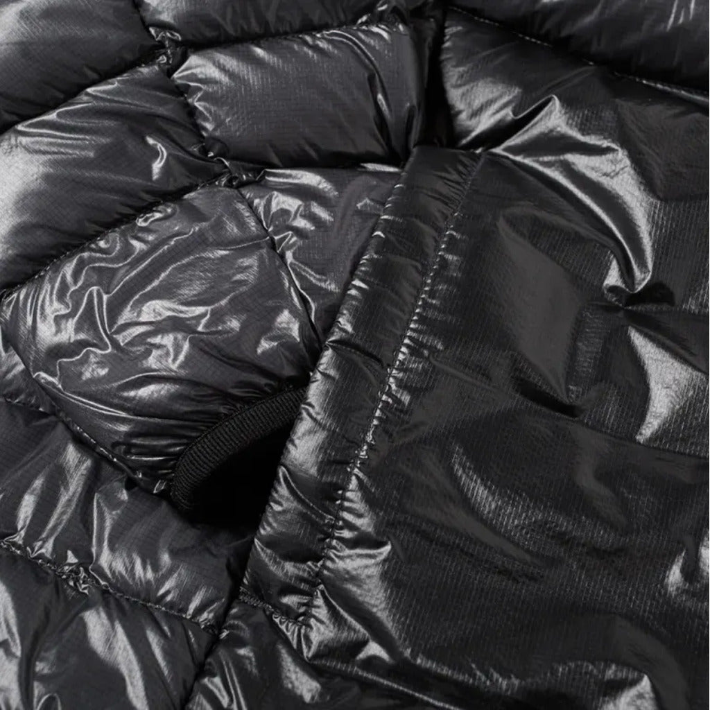 Second close-up of the resistant nylon micro-ripstop fabric on the CP Company grey down jacket.
