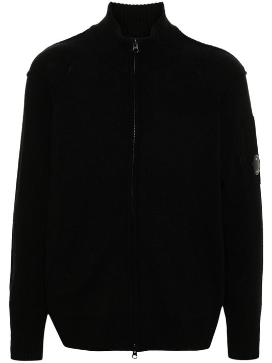CP Company black labswool lens-detailed zipped cardigan sweater, front view.
