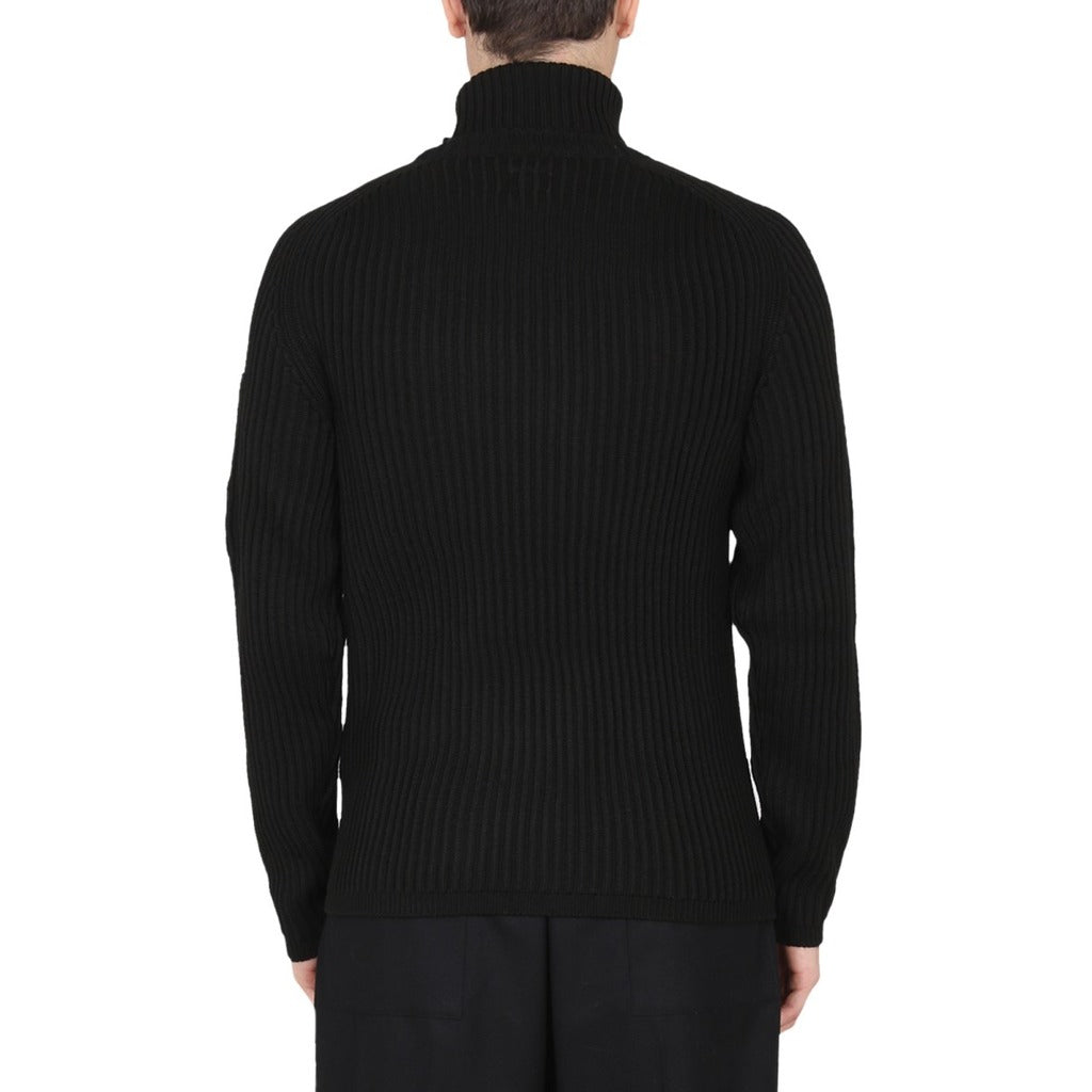 Back view of the CP Company black wool blend goggle pocket turtleneck sweater.

