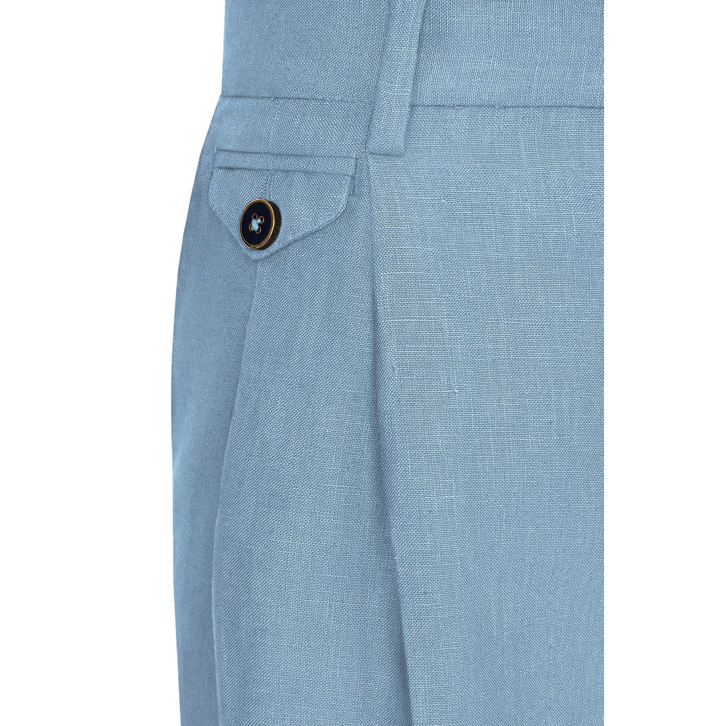 Detail of side welt pocket and buttoned back pocket on Dolce & Gabbana blue shorts
