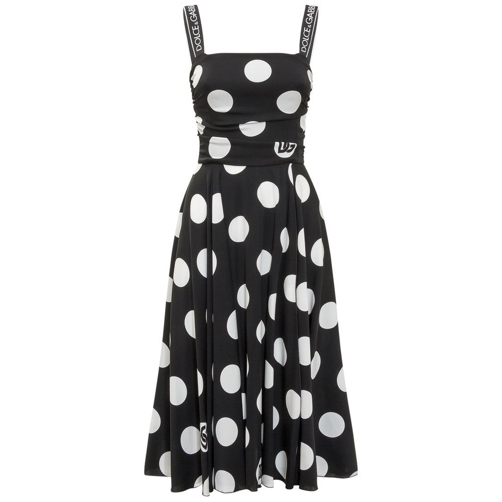 Dolce & Gabbana black midi dress with white polka dot print and logo straps, front view
