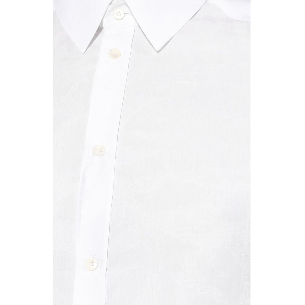 Button closure detail on the Dolce & Gabbana white shirt with floral stitching print
