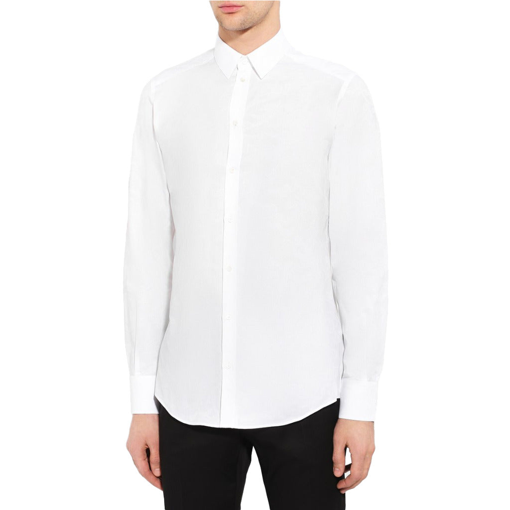 Model wearing the Dolce & Gabbana white cotton shirt with floral stitching print
