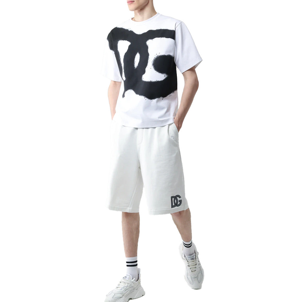 Model wearing Dolce & Gabbana white Bermuda shorts with black stripes, styled look
