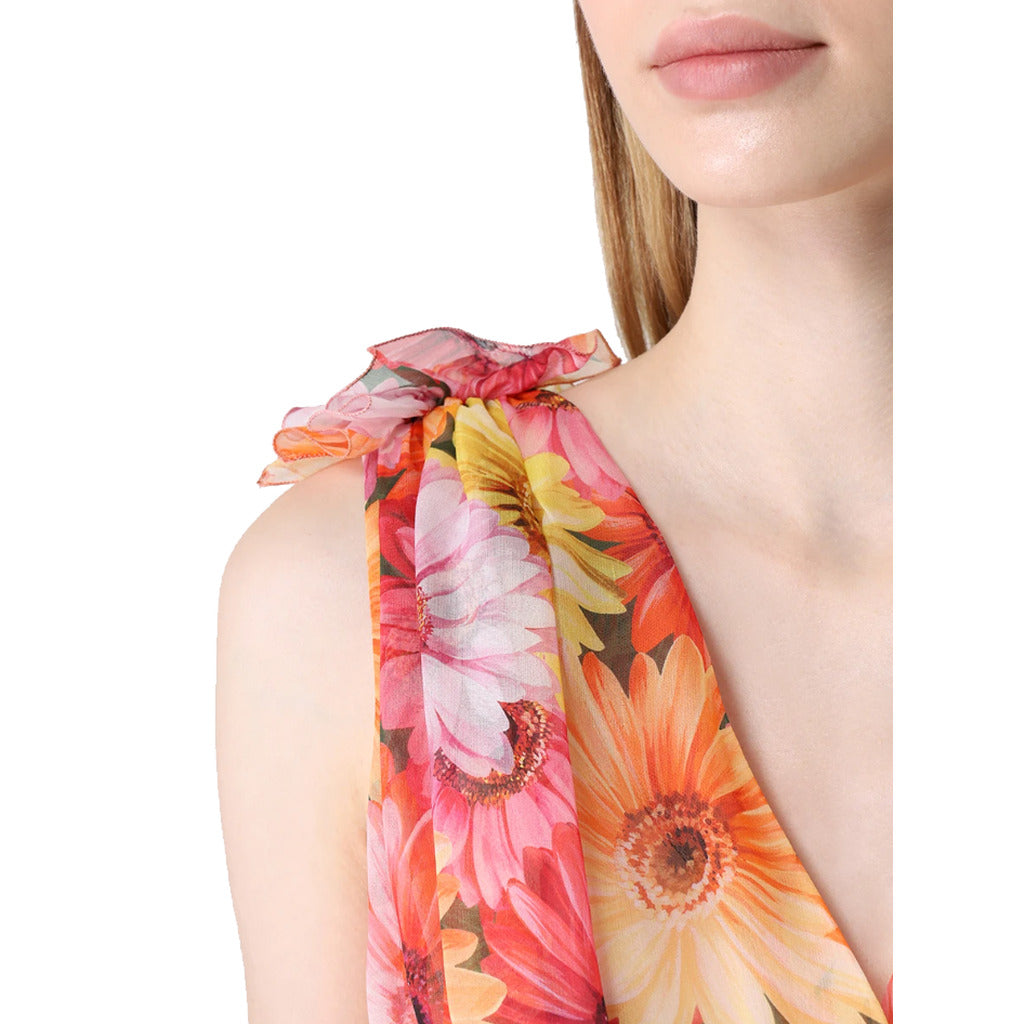 Detail of V-neckline and bow trim straps on Dolce & Gabbana floral print dress
