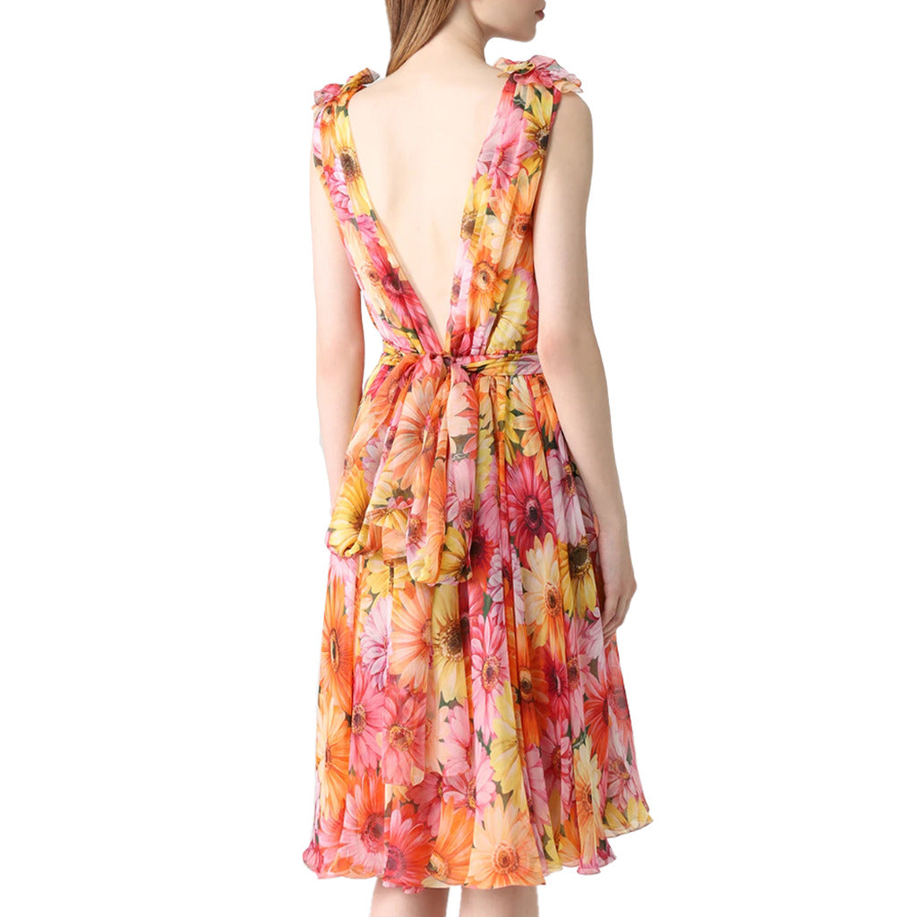 Back view of Dolce & Gabbana silk dress showing zipper closure and bow straps
