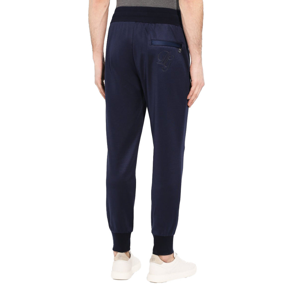 Back view of Dolce & Gabbana blue sweatpants showing embroidered logo
