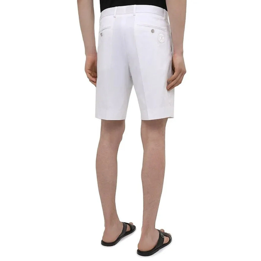 Back view of Dolce & Gabbana white chino shorts showing embroidered DG logo
