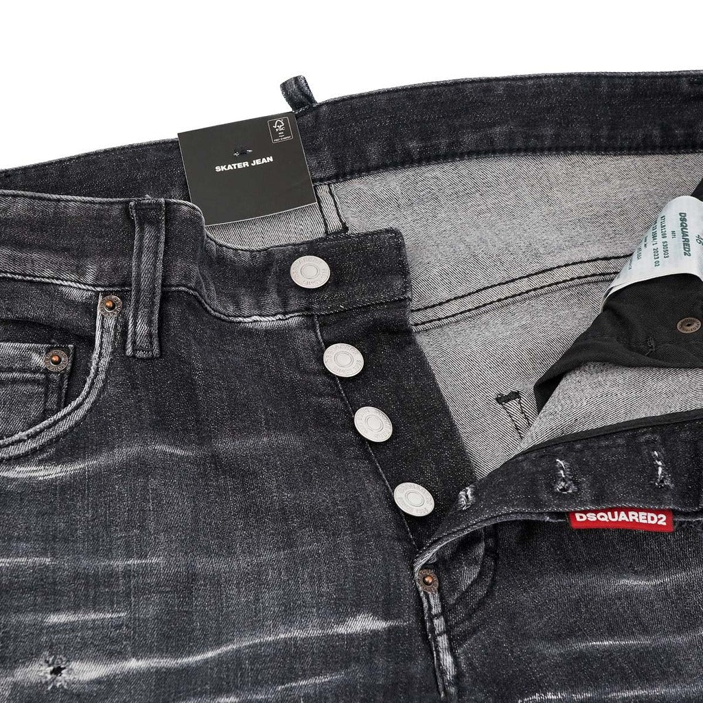 Detail of the button fly on black Dsquared2 distressed skater jeans