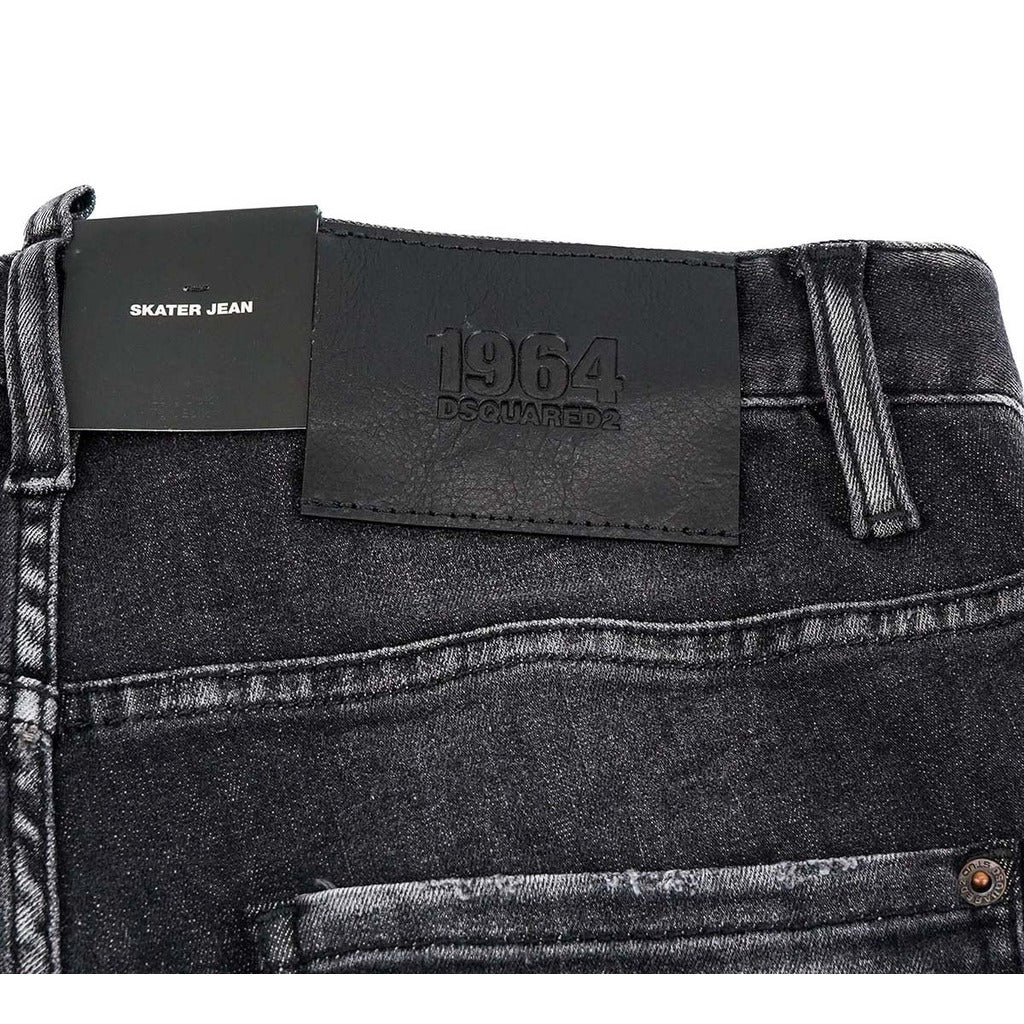 Black leather logo patch on Dsquared2 black distressed skater fit denim
