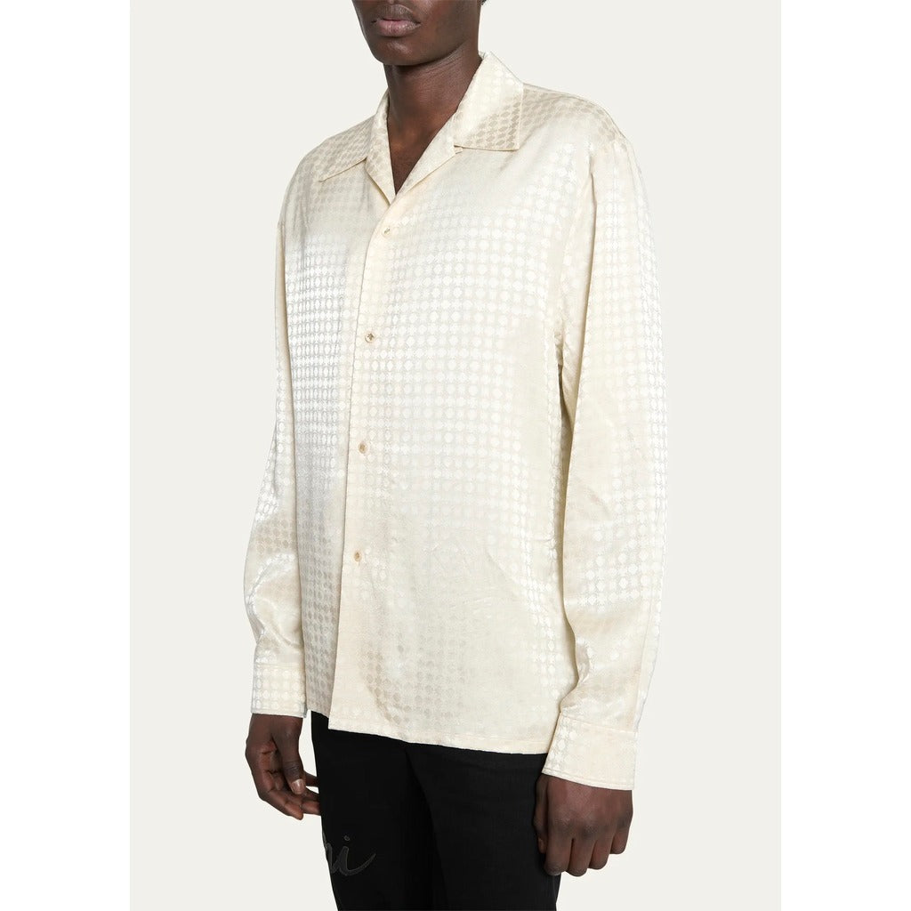 Model showcasing the normal fit of the Amiri MA Quad monogram long sleeve shirt.
