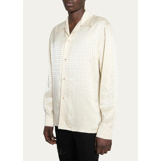 Model showcasing the normal fit of the Amiri MA Quad monogram long sleeve shirt.
