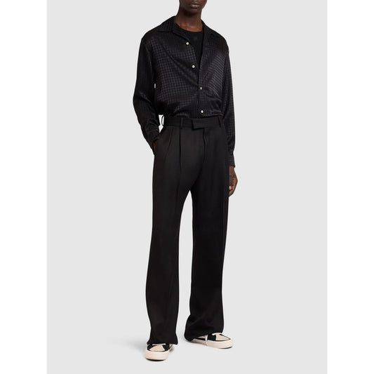 Model showcasing the regular fit of the Amiri MA Quad monogram long sleeve shirt with notched collar