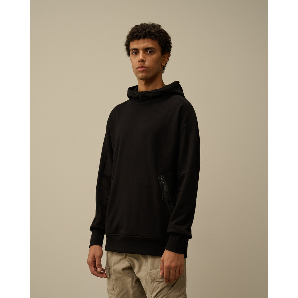 Model showcasing the regular fit of the CP Company black diagonal cotton Goggle hoodie