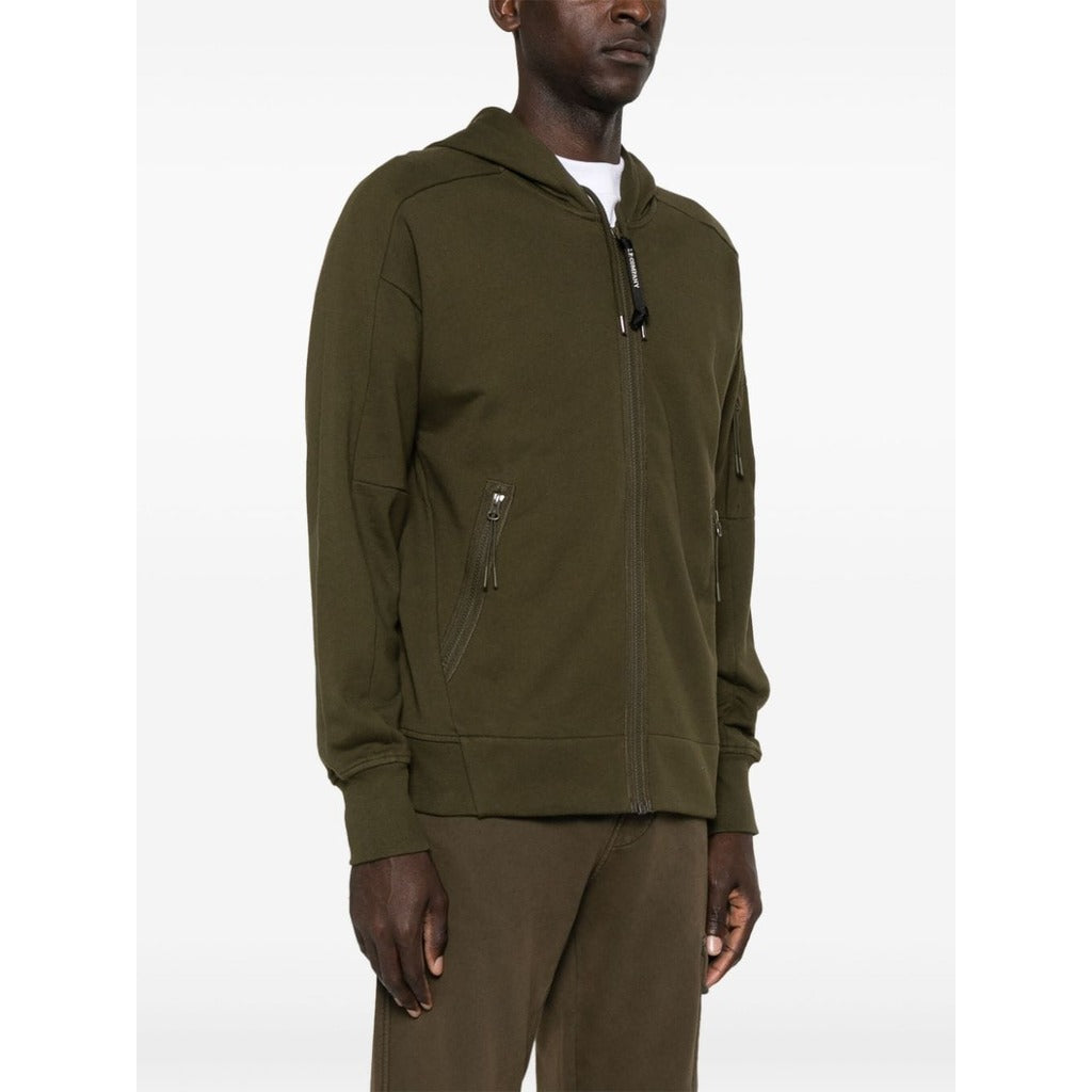 Model showcasing the regular fit of the CP Company green cotton goggle zip hoodie