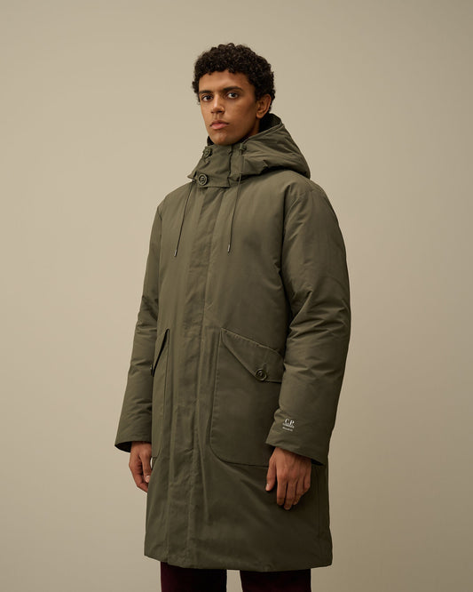 Model showcasing the regular fit of the CP Company Micro-M (R) down parka in green