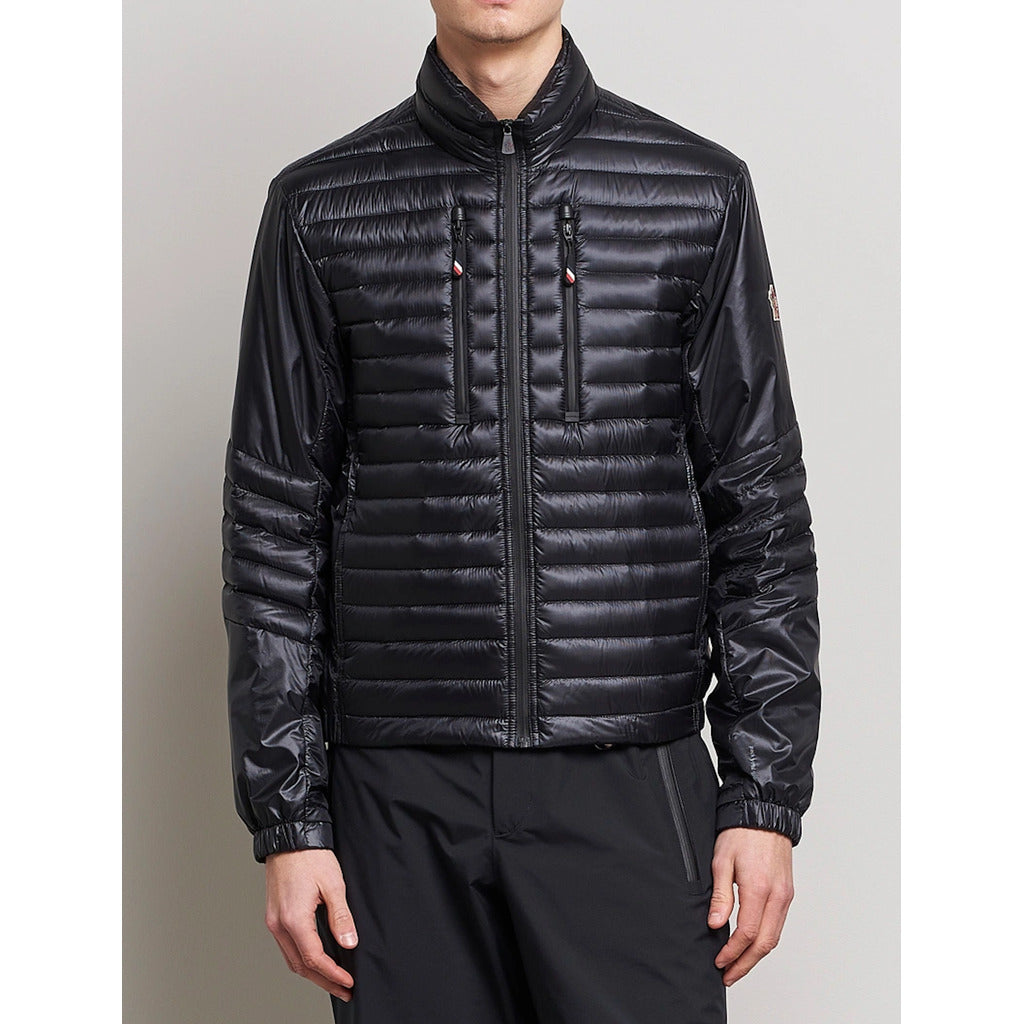 Moncler Grenoble black high-shine padded down jacket front view
on model