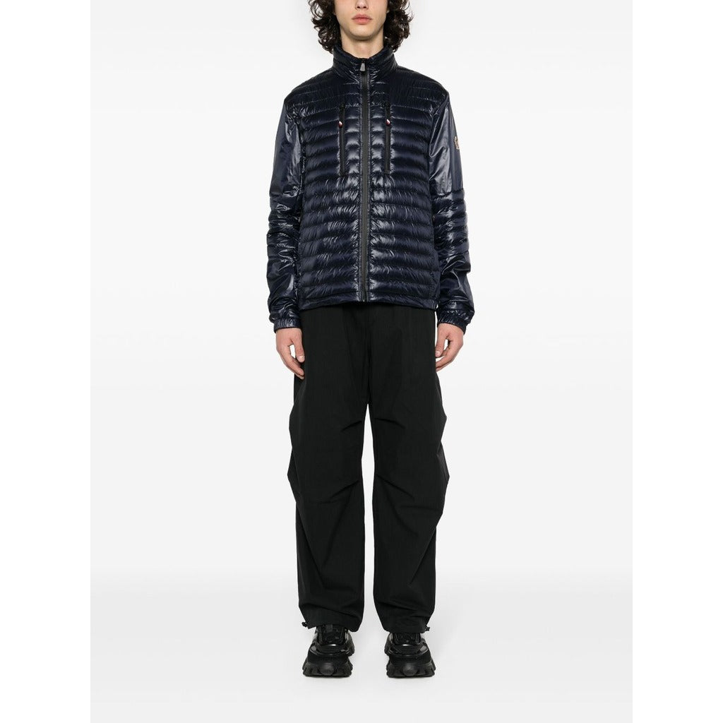 Moncler Grenoble dark blue high-shine padded down jacket front view on model
