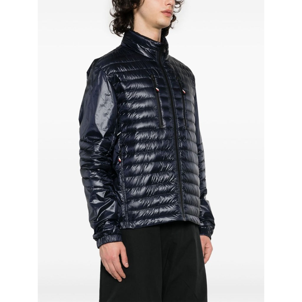 Side profile view of the Moncler Grenoble dark blue high-shine padded jacket

