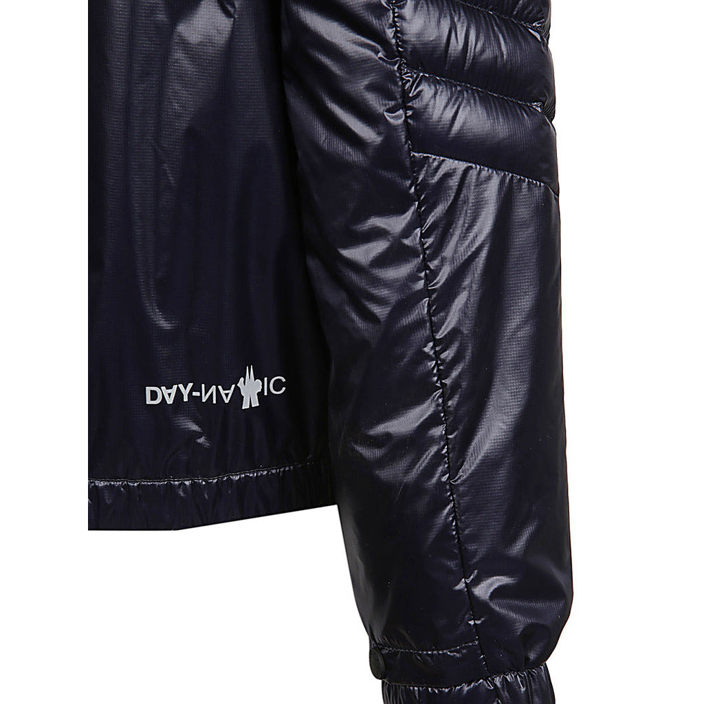 Close-up of the side zip-fastening pocket and Day Namic logo on the Moncler Grenoble dark blue high-shine jacket
