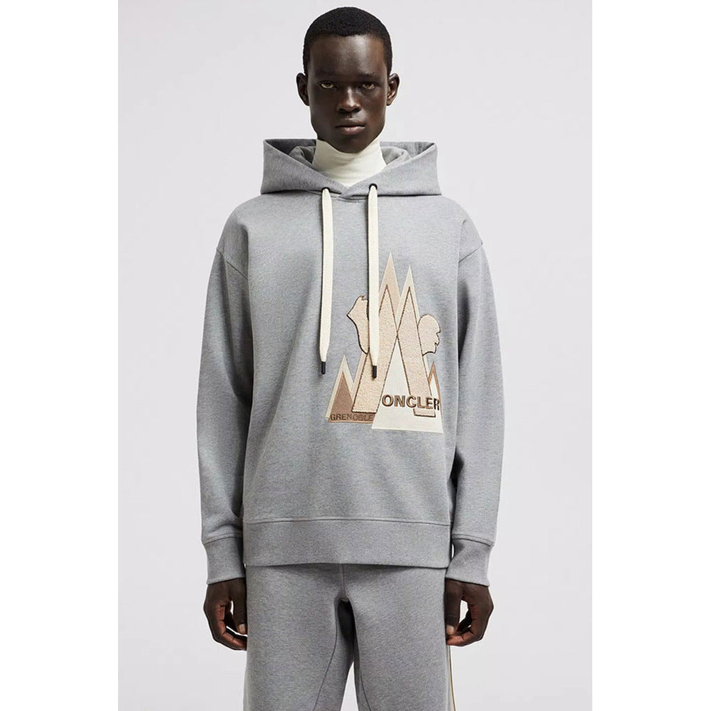 Moncler Grenoble gray cotton hoodie front view with logo patch on model