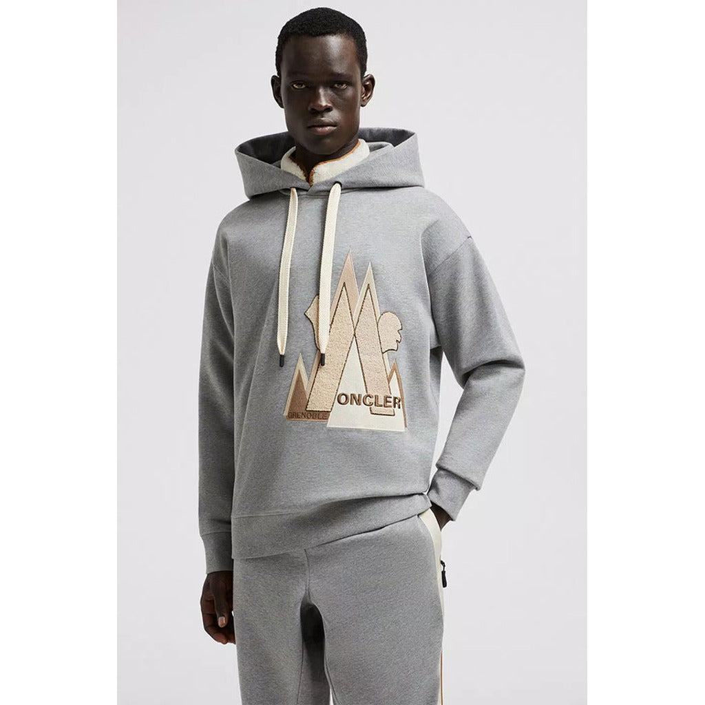 Angled view of the Moncler Grenoble gray pullover hoodie
