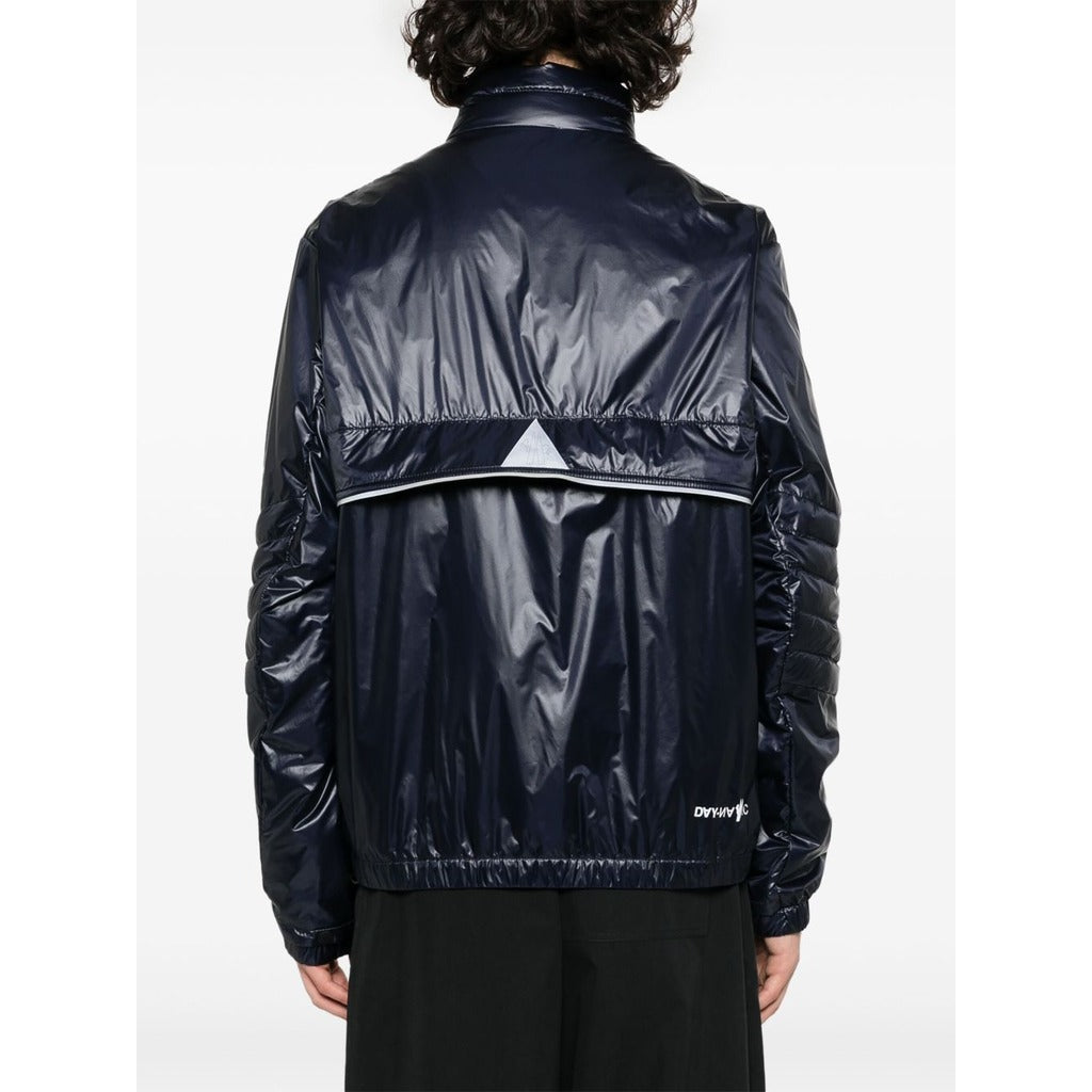 Back view of the Moncler Grenoble dark blue high-shine puffer jacket on model

