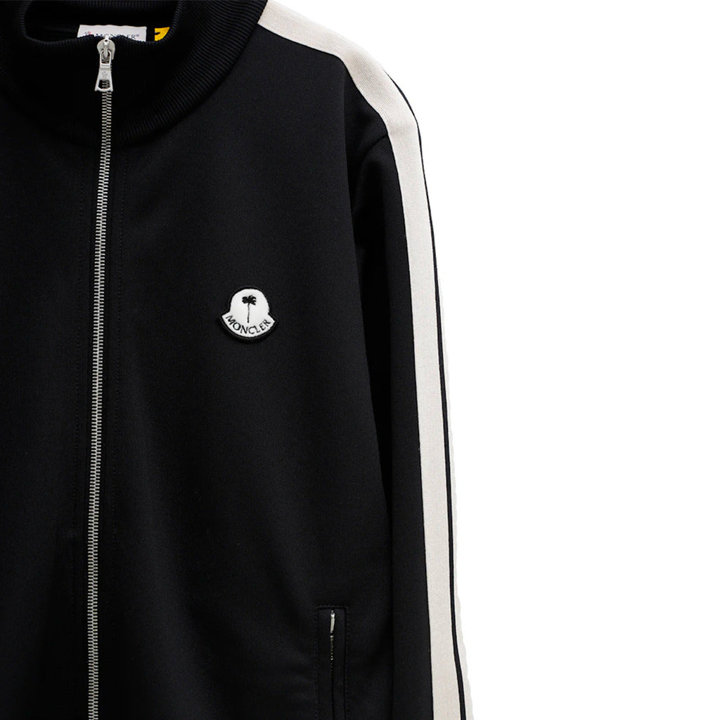 Close-up of the velour logo patch on the chest of the Moncler x Palm Angels track jacket

