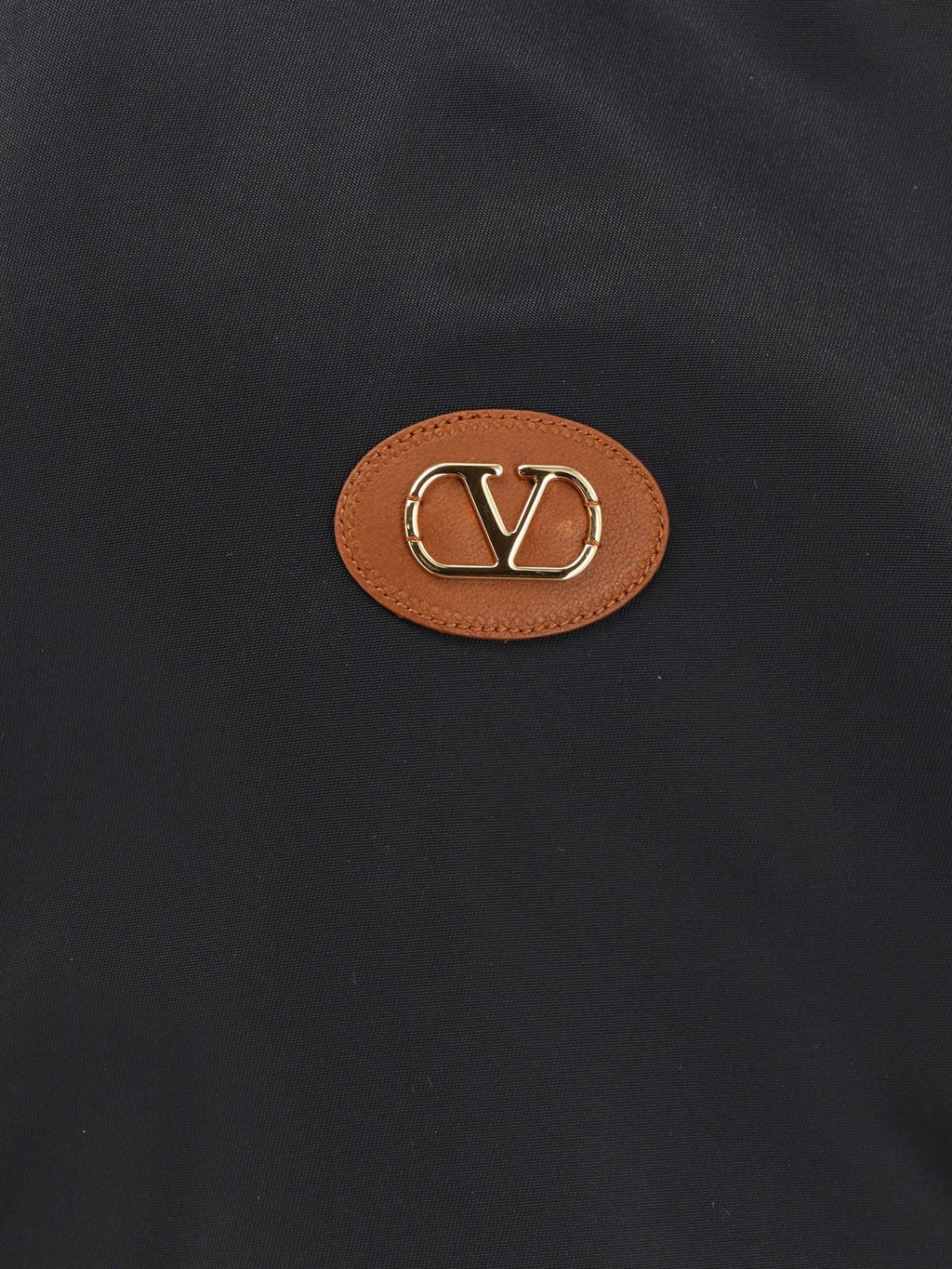 Valentino Nailono bomberis su odiniu antsiuvu ir VLogo detalėmis