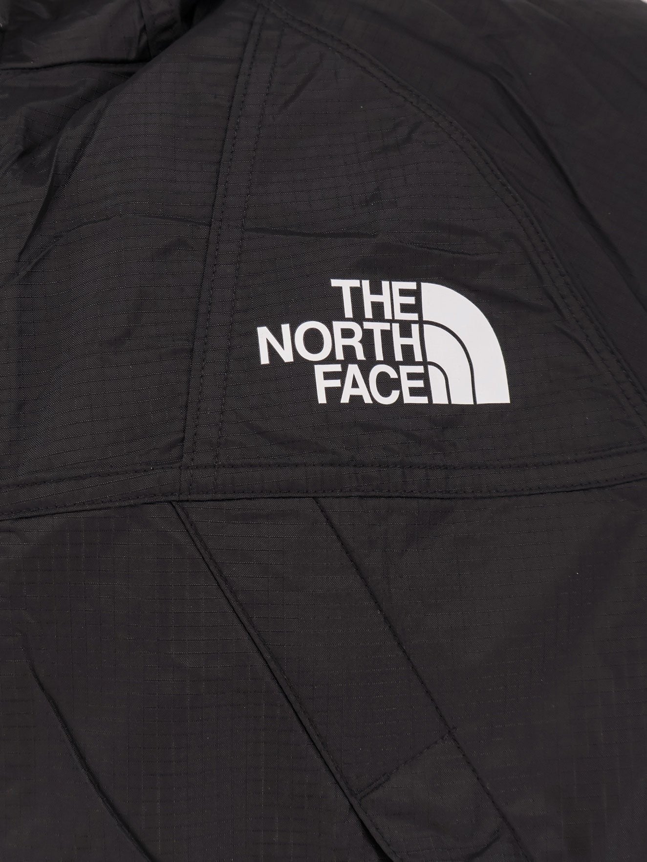 The North Face Nylon jacket with logo on the front and on the back