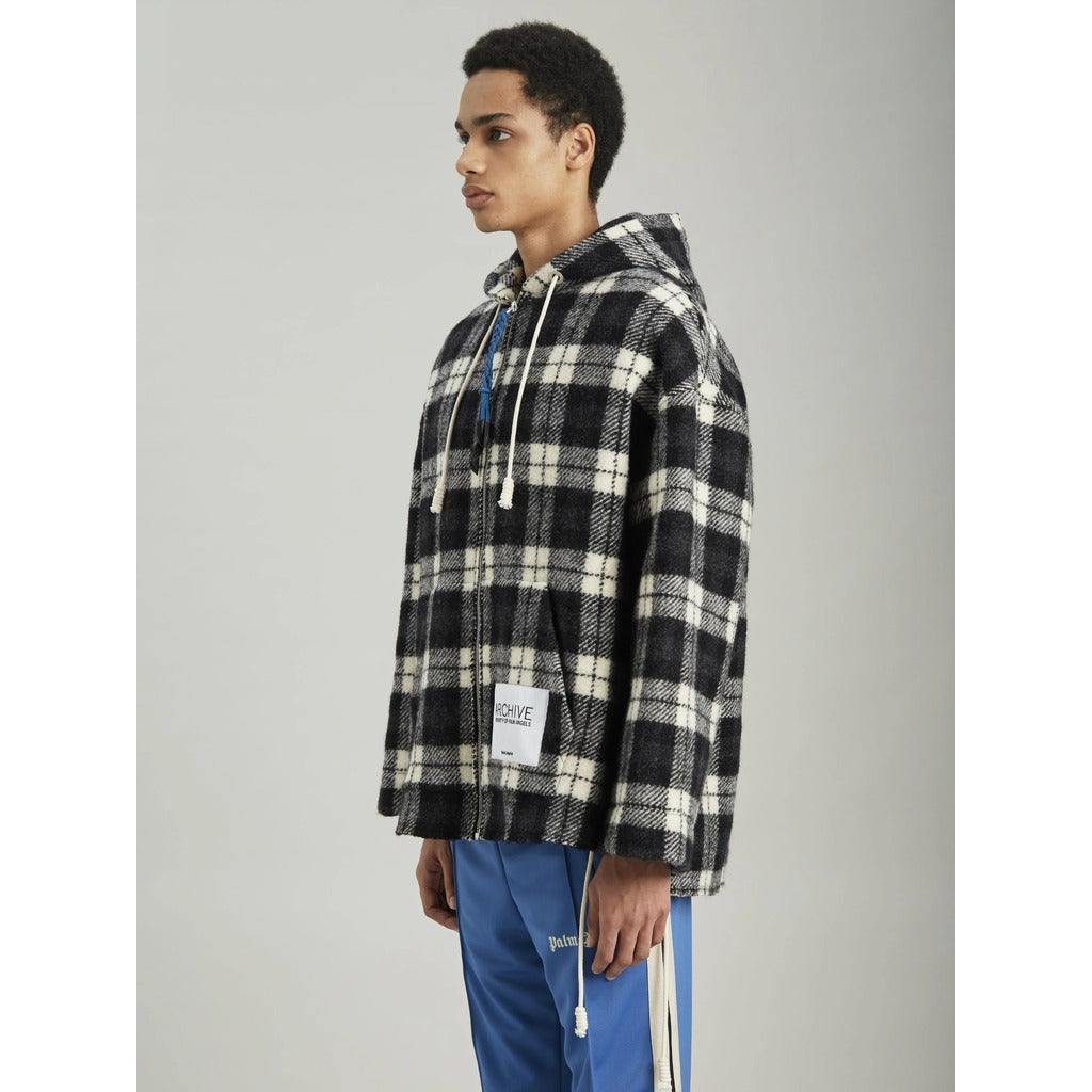 Detail of the beige and black check pattern on the Palm Angels cashmere jacket
