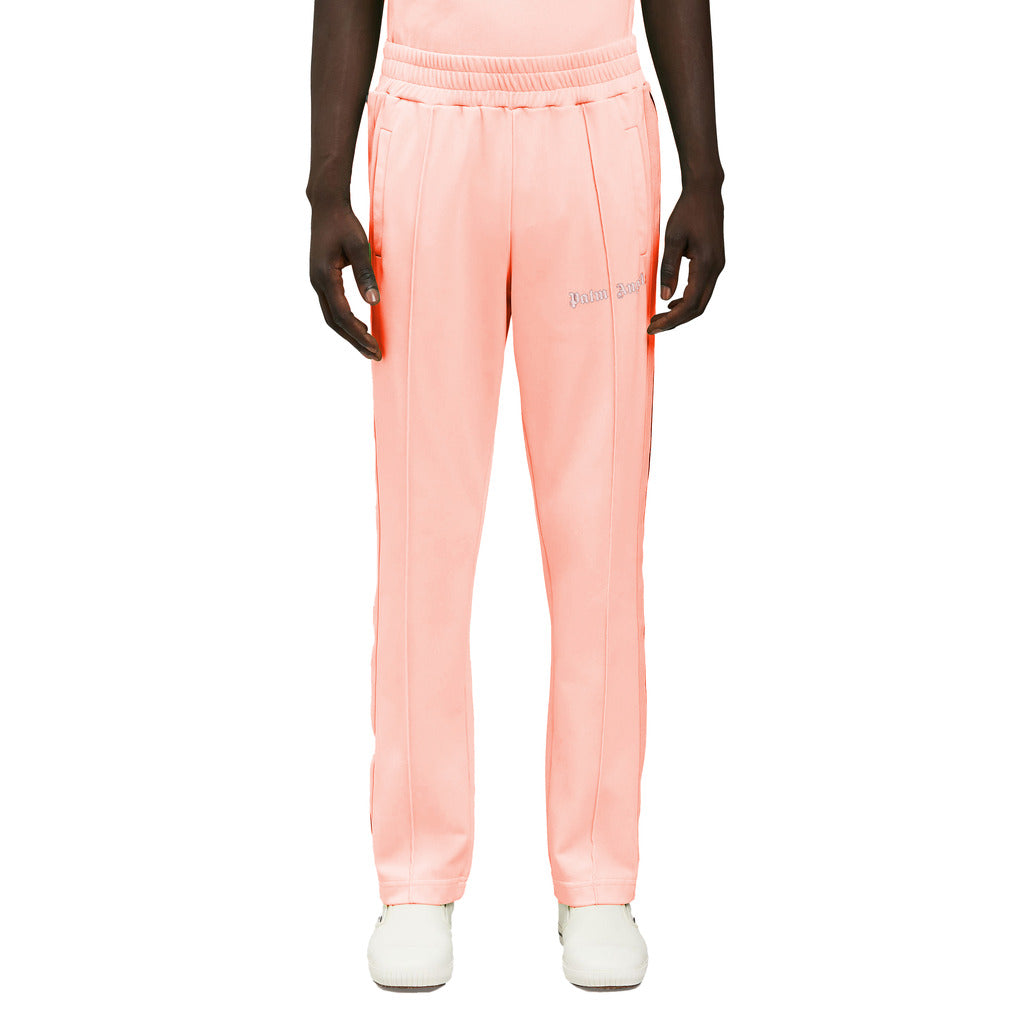 Palm Angels neon orange track pants highlighting premium Italian make
