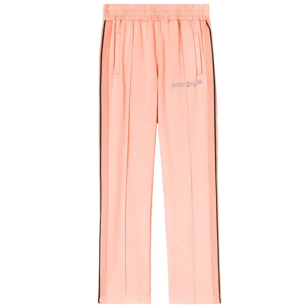 Palm Angels neon orange nylon track pants with black side stripes front view