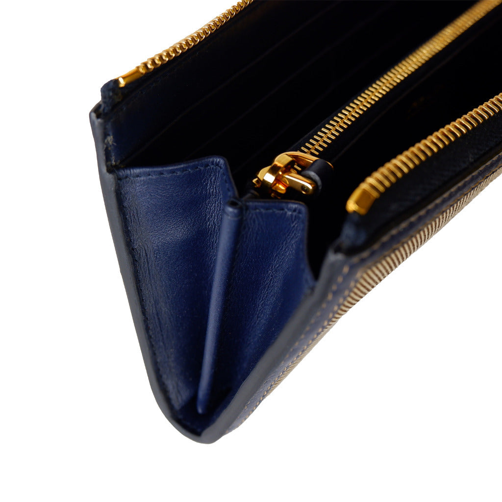 Angled view of the Prada canvas zip wallet in brown and blue
