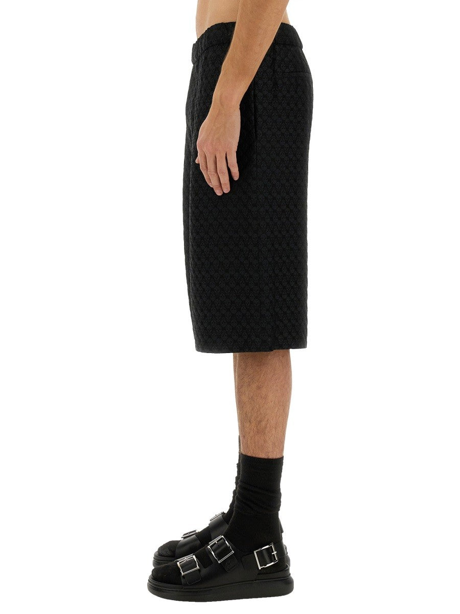 Alexander Mcqueen PANTALONI SCURȚI CU MODEL JACQUARD CRANIU