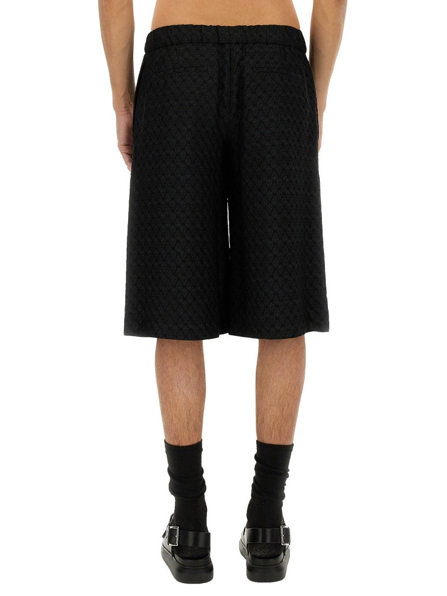 Alexander Mcqueen PANTALONI SCURȚI CU MODEL JACQUARD CRANIU