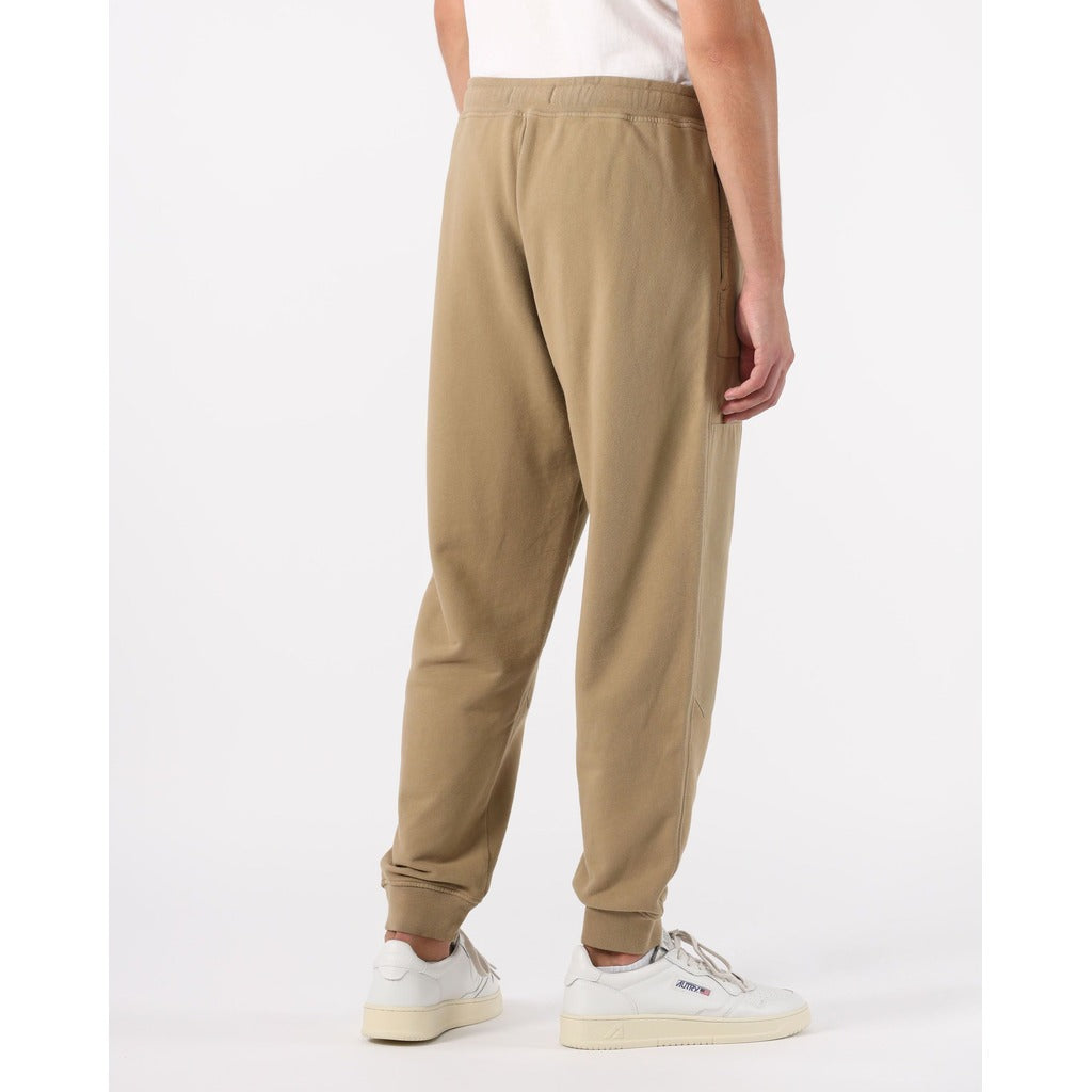 Detail of the button-fastened side cargo pocket on the Stone Island beige cotton pants