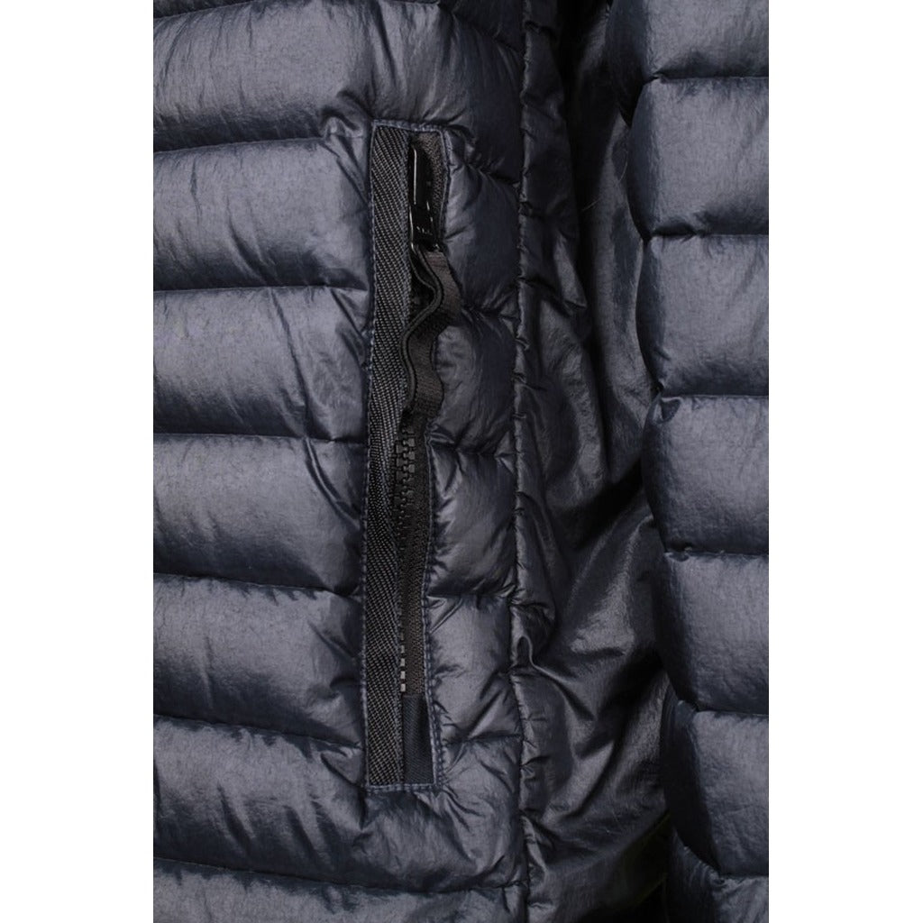 Double-slider zipper closure detail on the Stone Island blue nylon jacket.
