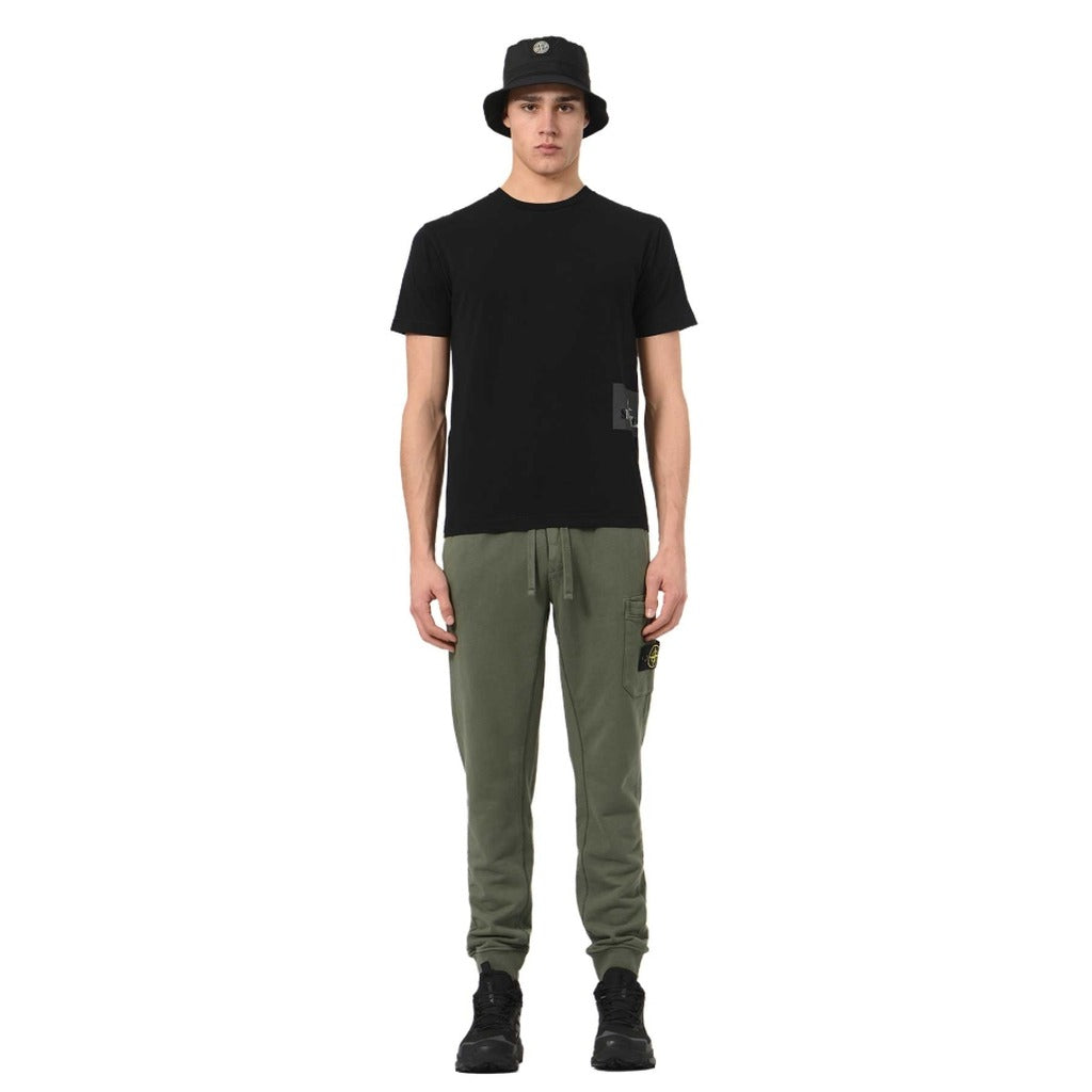 Detail of the elasticated drawstring waistband on the Stone Island green cotton tracksuit trousers