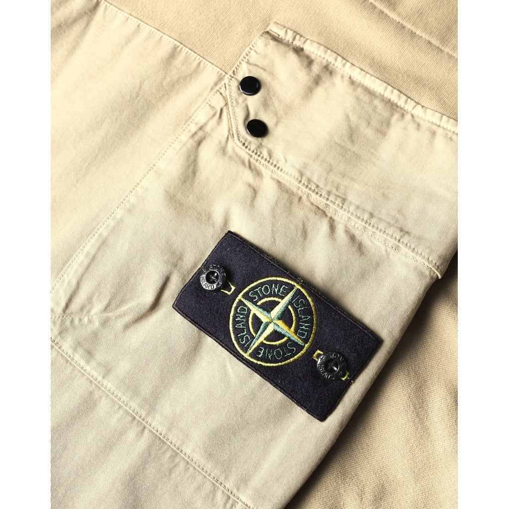 Waistband detail of the Stone Island beige cotton utility cargo trousers.
