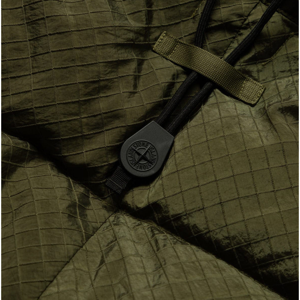 Front zip and button fastening detail on the Stone Island green down coat.