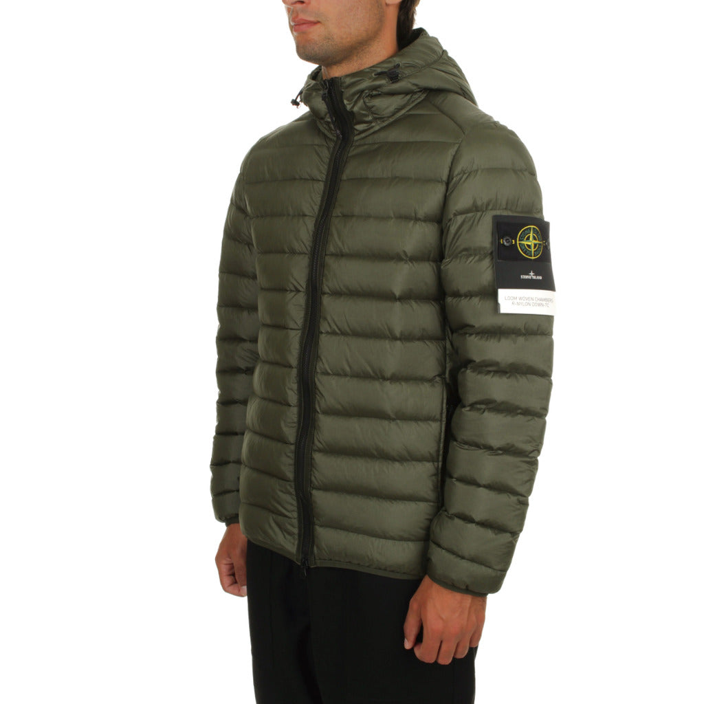Close-up of the Stone Island compass logo patch on the sleeve of the down jacket.

