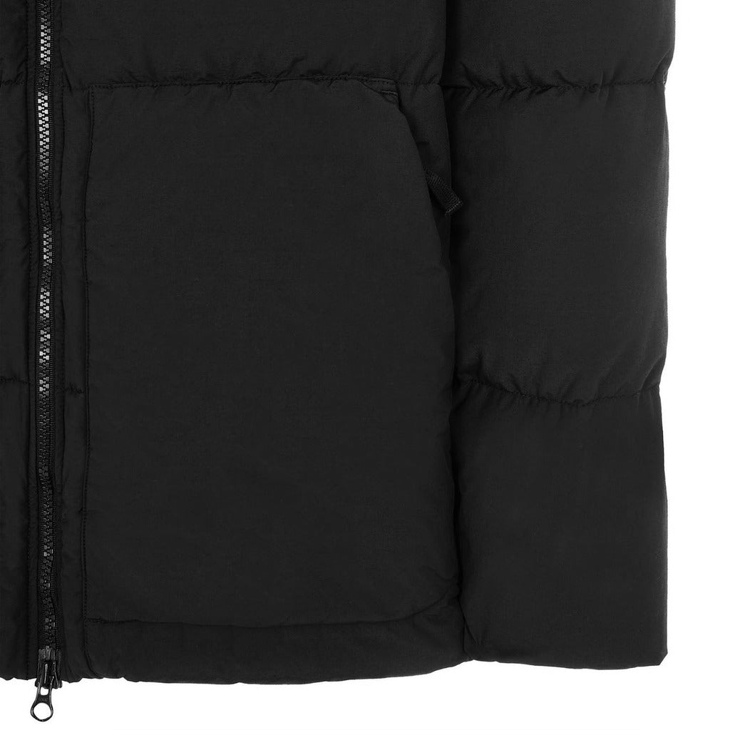 Model wearing the Stone Island black nylon hooded down coat