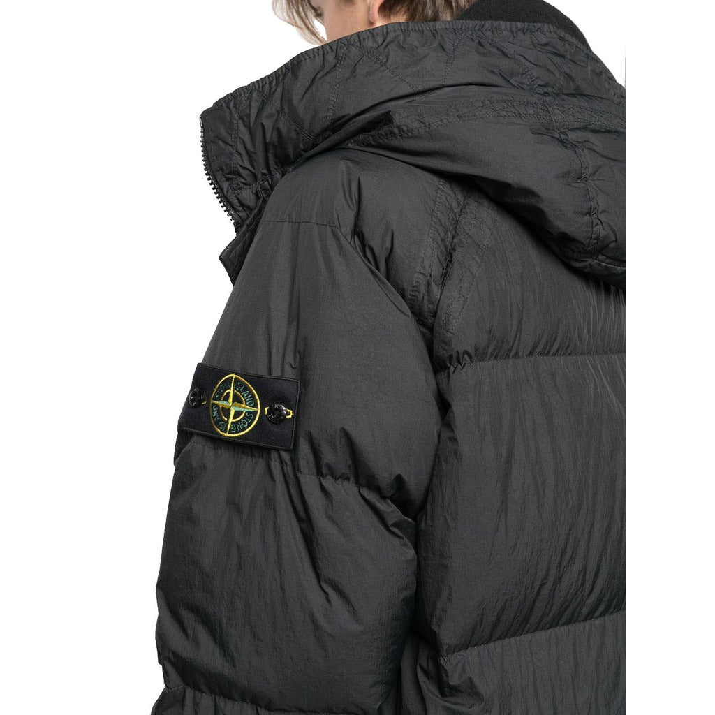 Detail of the drawstring hood on the Stone Island long black down coat.
