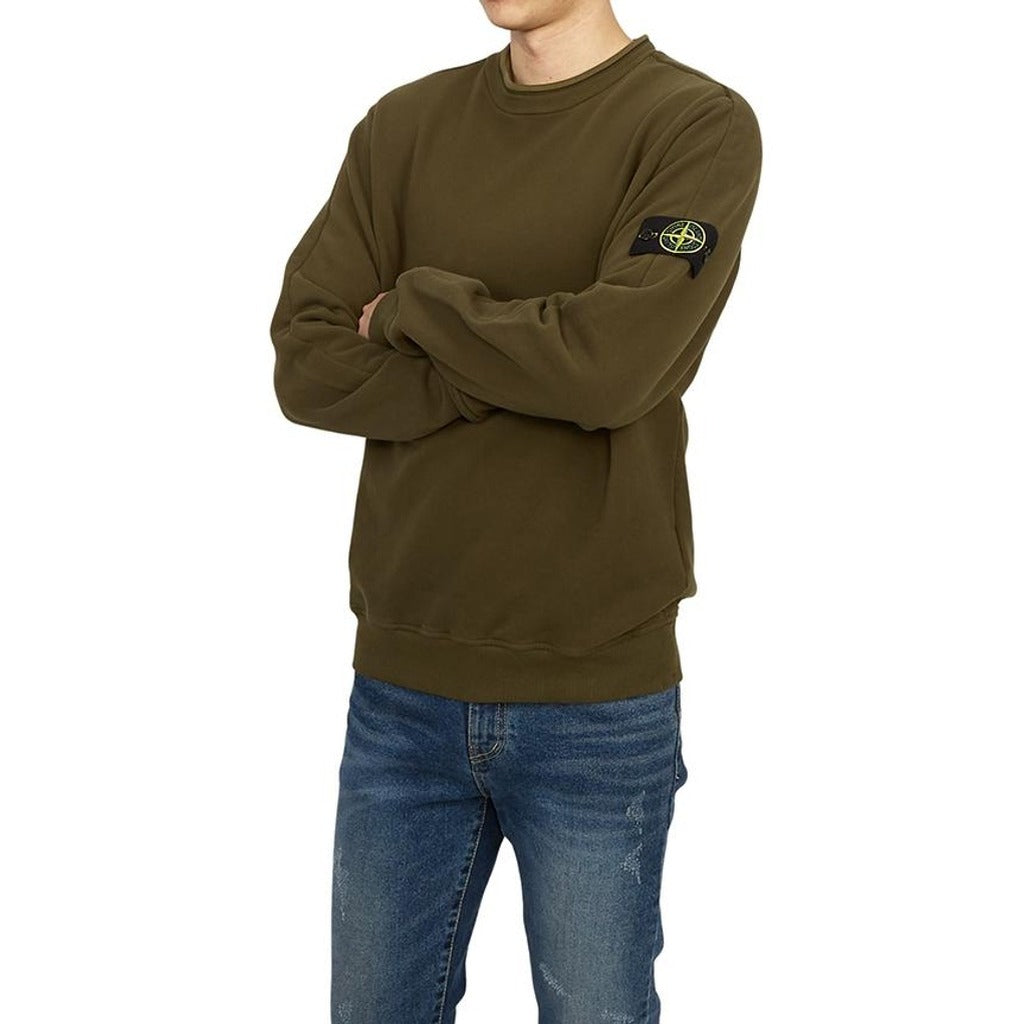 Model wearing the Stone Island olive green cotton blend crewneck sweatshirt.
