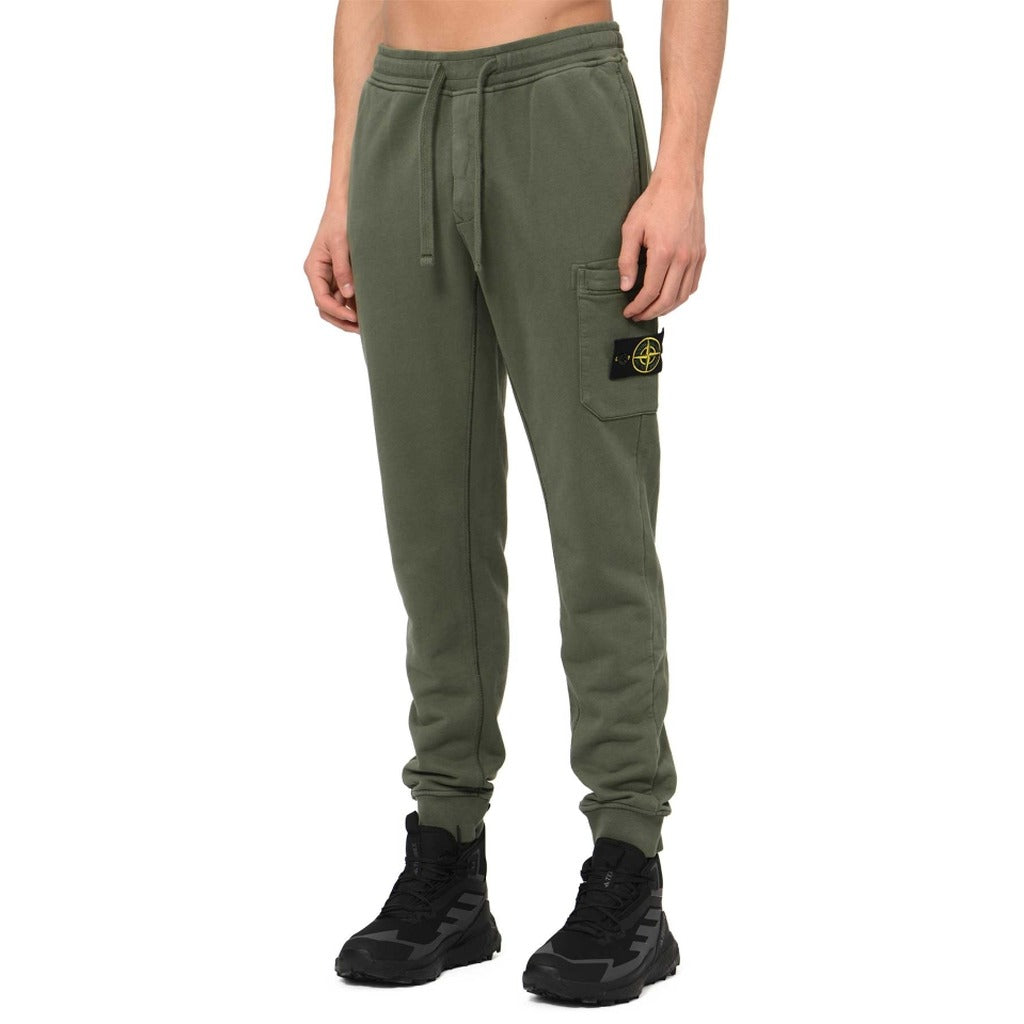 Stone Island green organic cotton fleece joggers, slim fit, front view.
